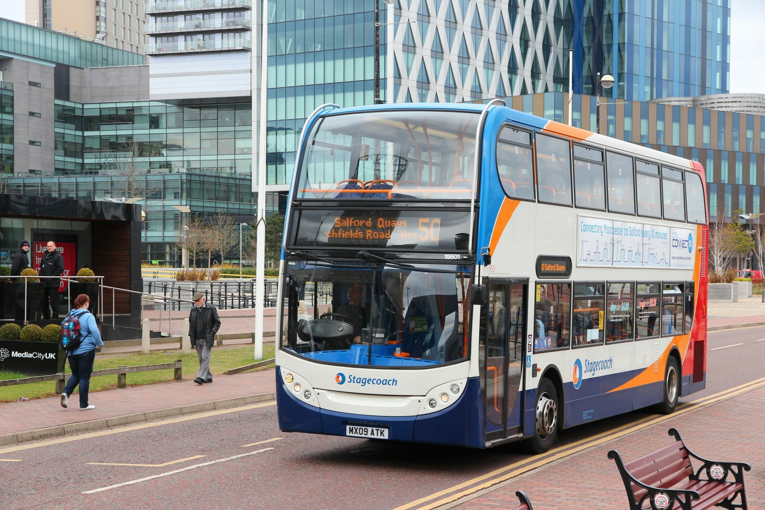 Stagecoach transport coach driving down the road 
